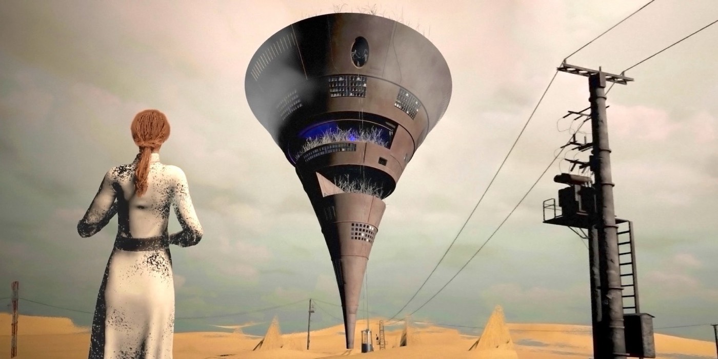 Still from From Dust: a woman seen from behind, facing a floating funnel-shaped tower in a desert